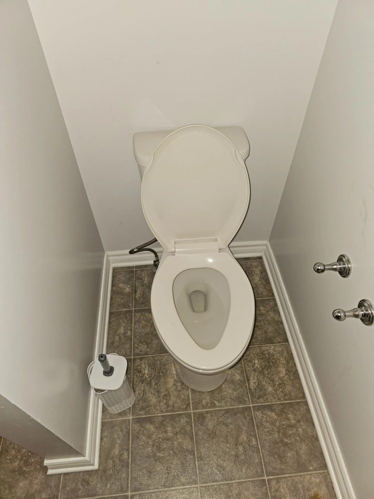 Bathroom toilet and floor spotless and disinfected after cleaning