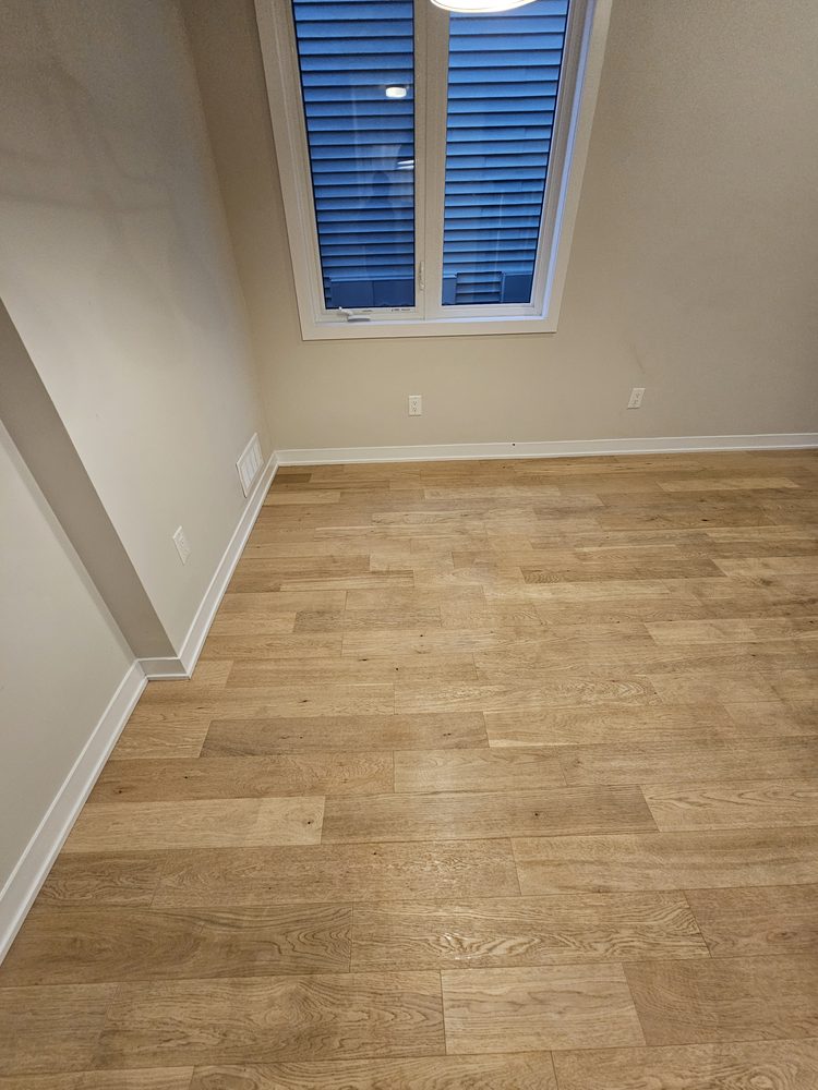 Hardwood floor restored to a clean, glossy shine after cleaning